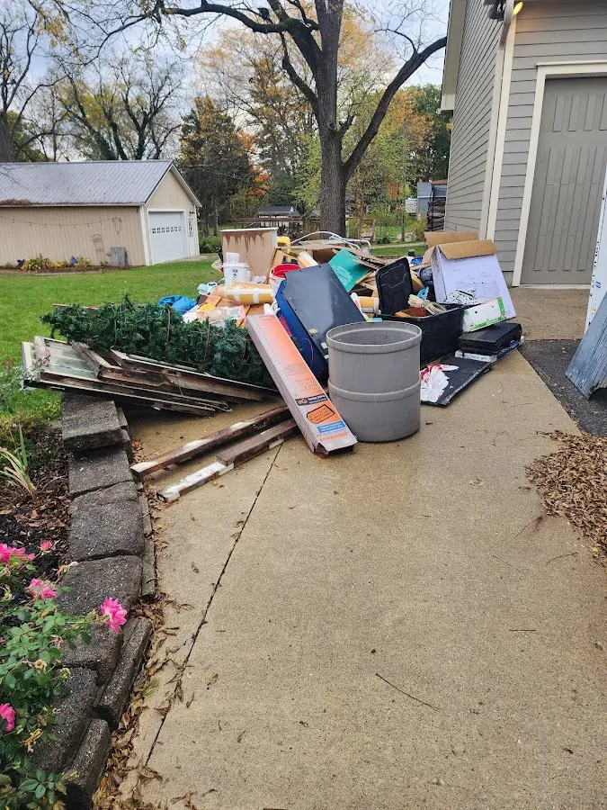Dumpster being loaded with debris for Demolition Dumpster Rental in Mount Clemens